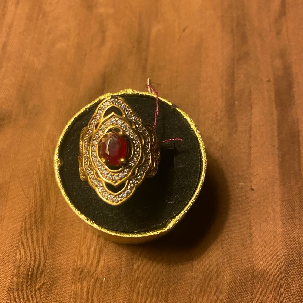 Nice Sterling and yellow gold bronze with a Ruby and white topaz